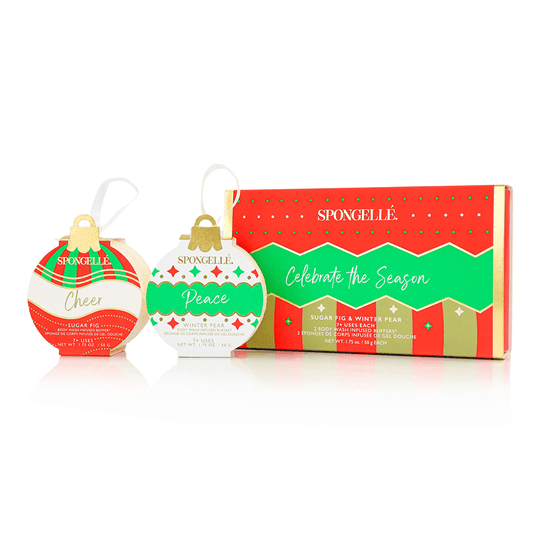 a group of christmas ornaments next to a box