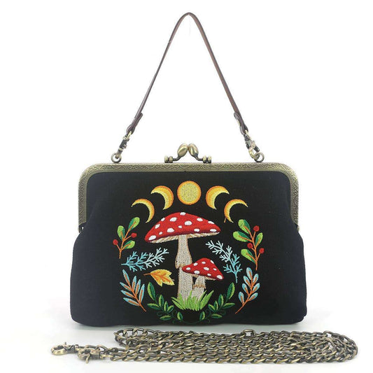 a black purse with a chain