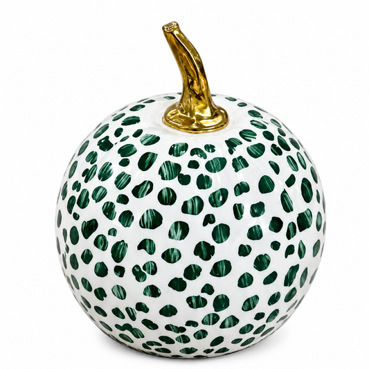 a white and green spotted pumpkin