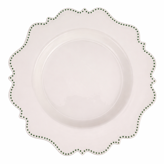 a white plate with green dots