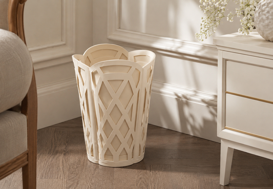 a white trash can in a corner of a room