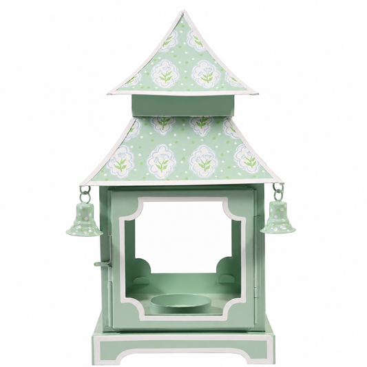 a green and white object with bells