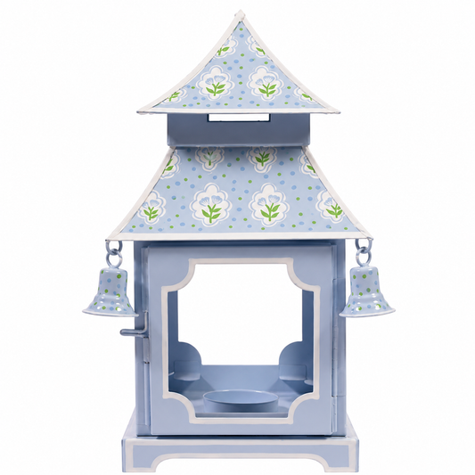 a blue and white object with bells