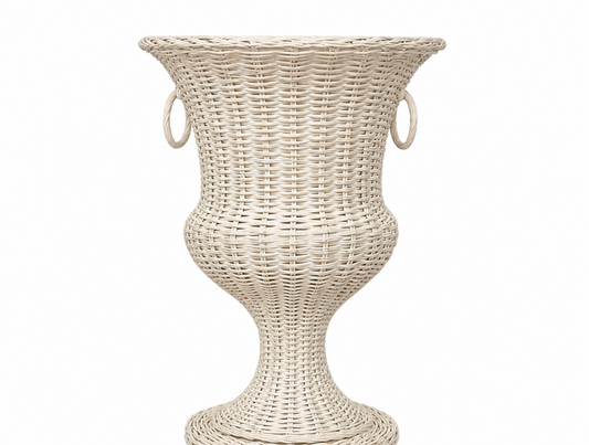 a white wicker vase with handles with Museo Soumaya in the background