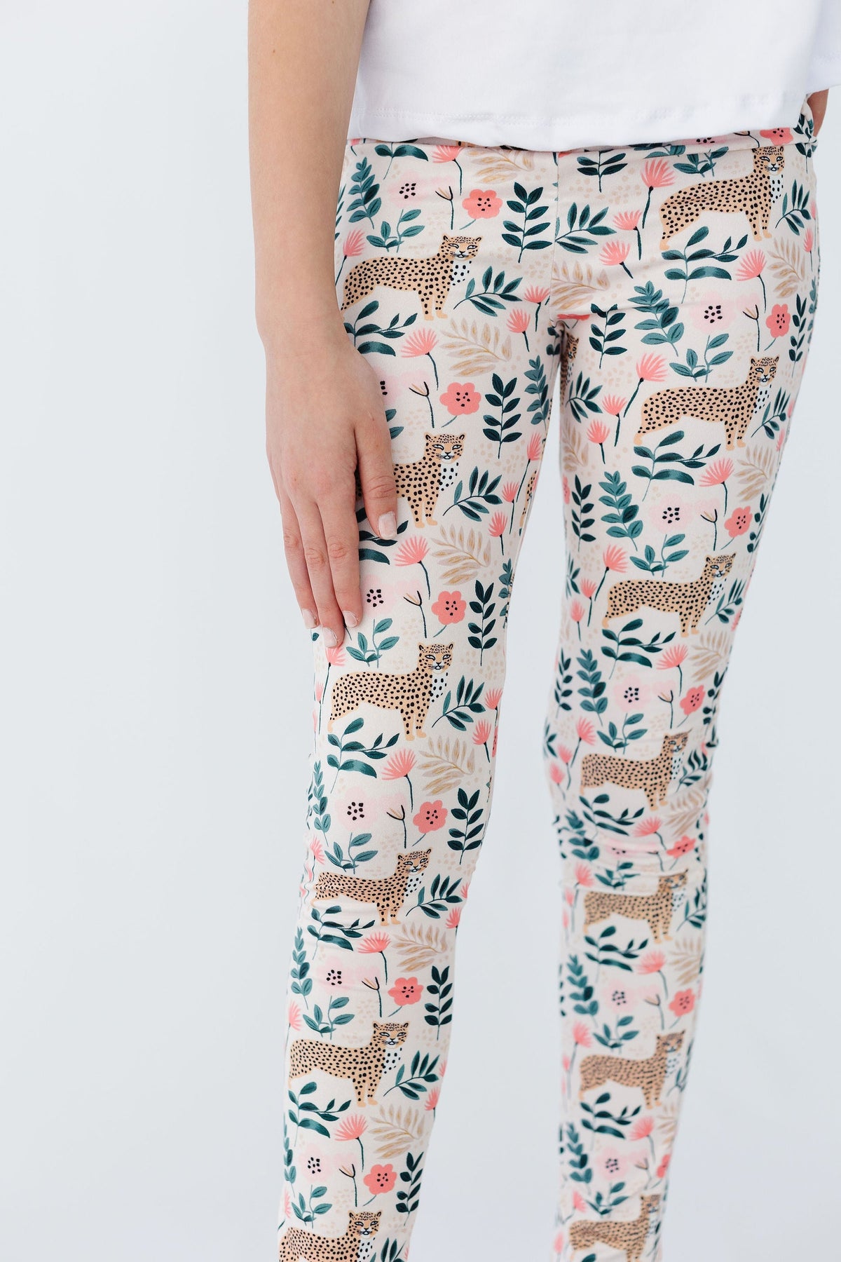 a person wearing floral pants