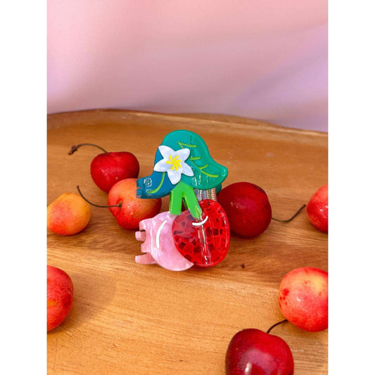 a group of cherries on a table