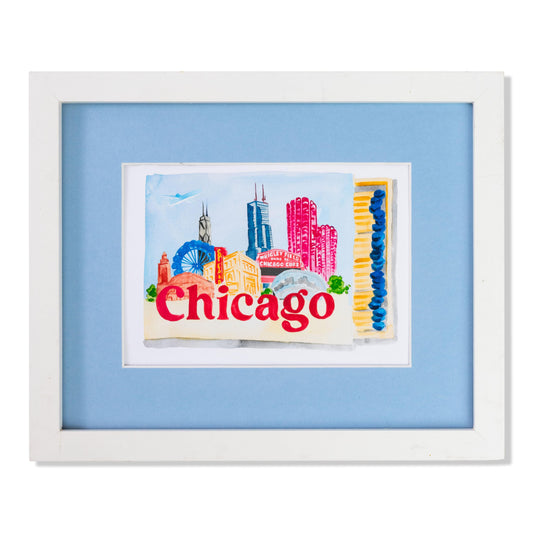 a framed picture of a chicago city