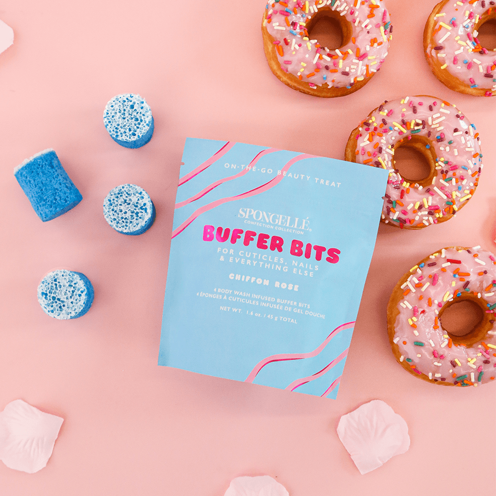 a group of donuts next to a blue bag