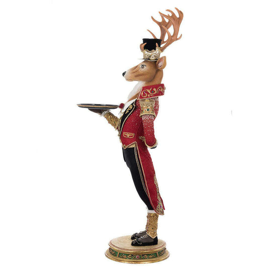 a statue of a deer holding a tray