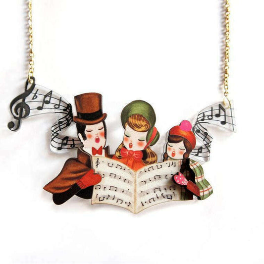 a necklace with a group of people singing