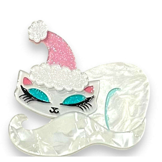 a white cat with pink and blue eyes and a pink hat