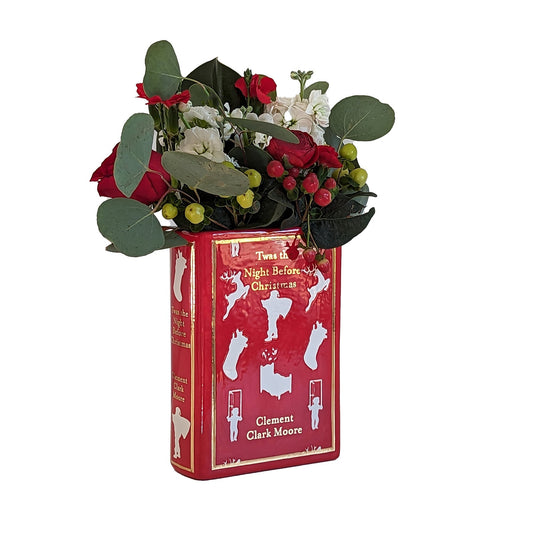 a red book with flowers in it