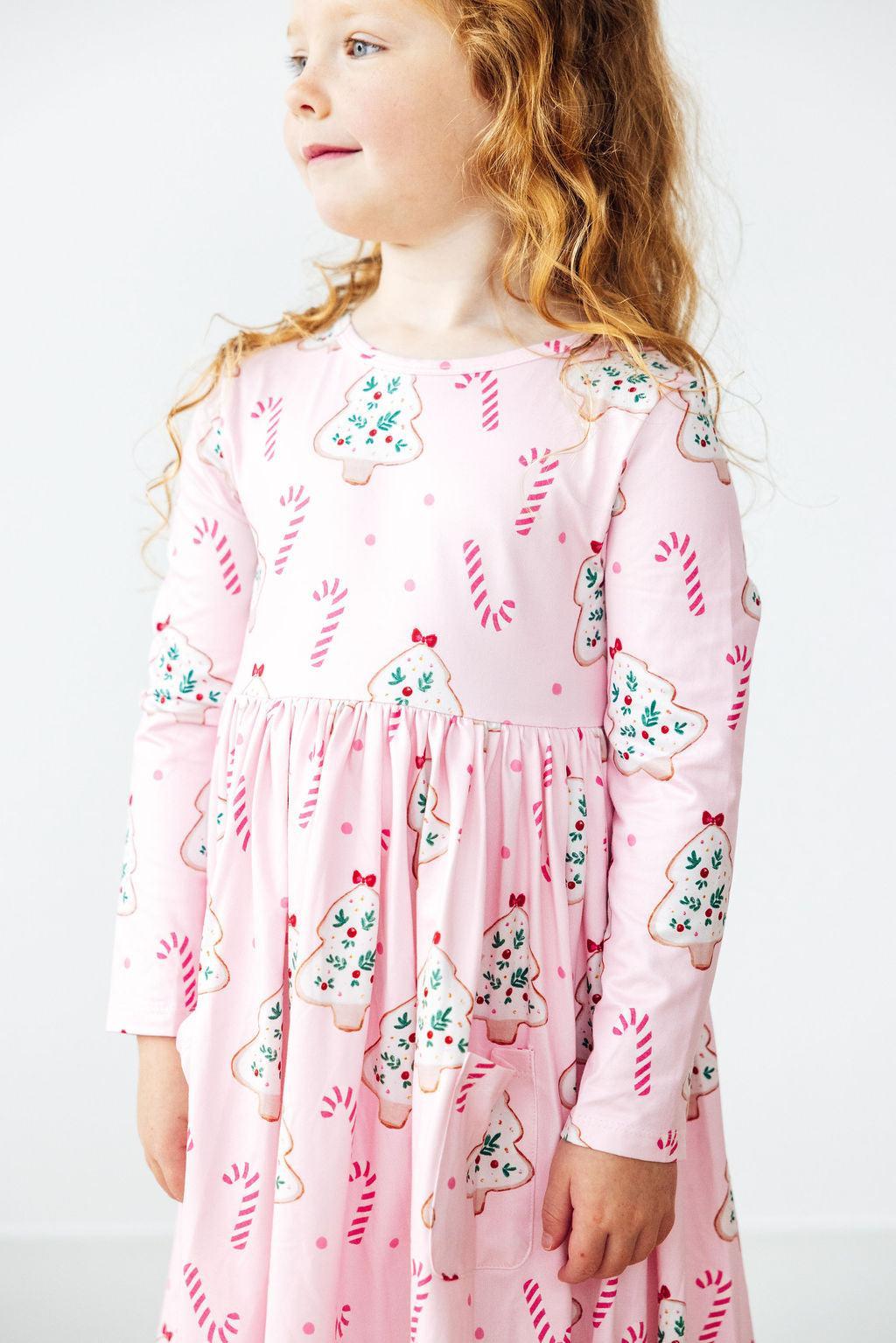 a girl in a pink dress
