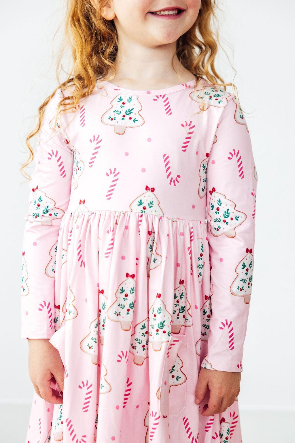 a girl wearing a pink dress