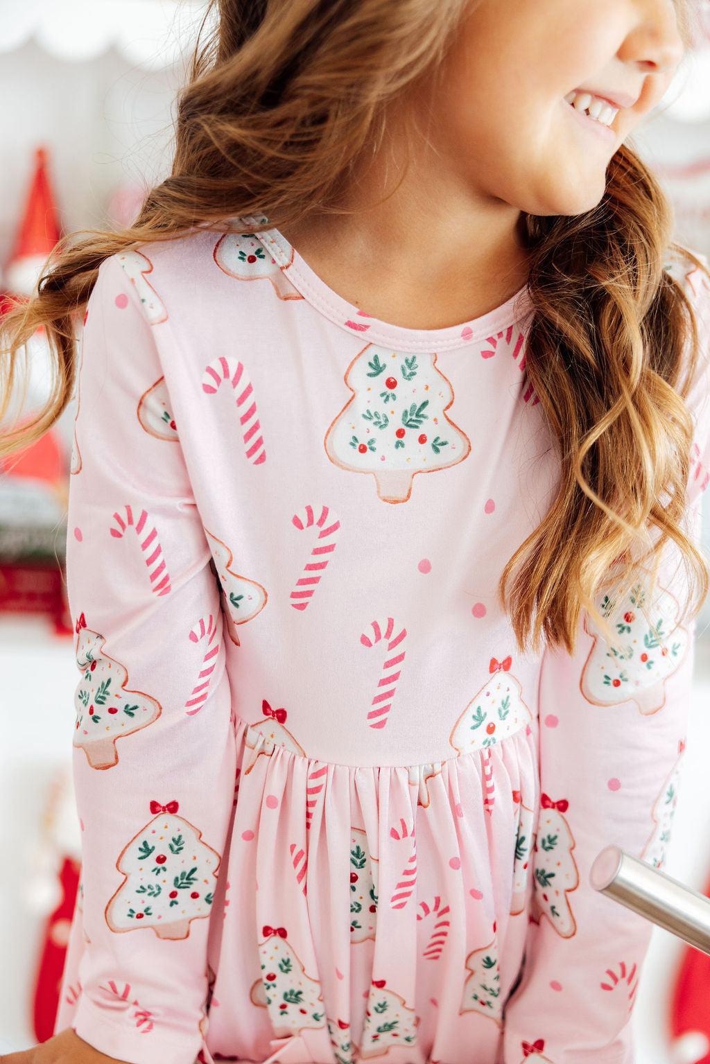 a girl in a pink dress
