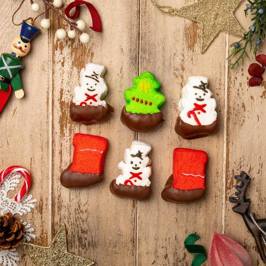 a group of chocolate candies on a wood surface