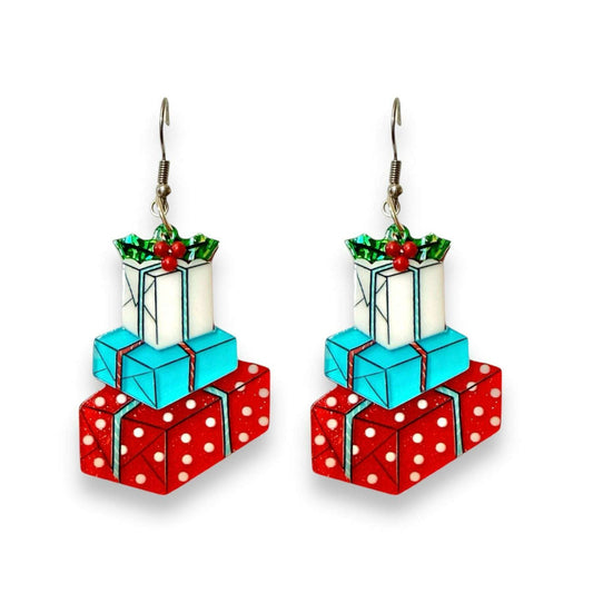 a pair of earrings with presents on them