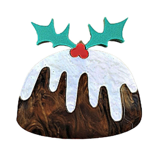 a christmas pudding with white frosting and green leaves