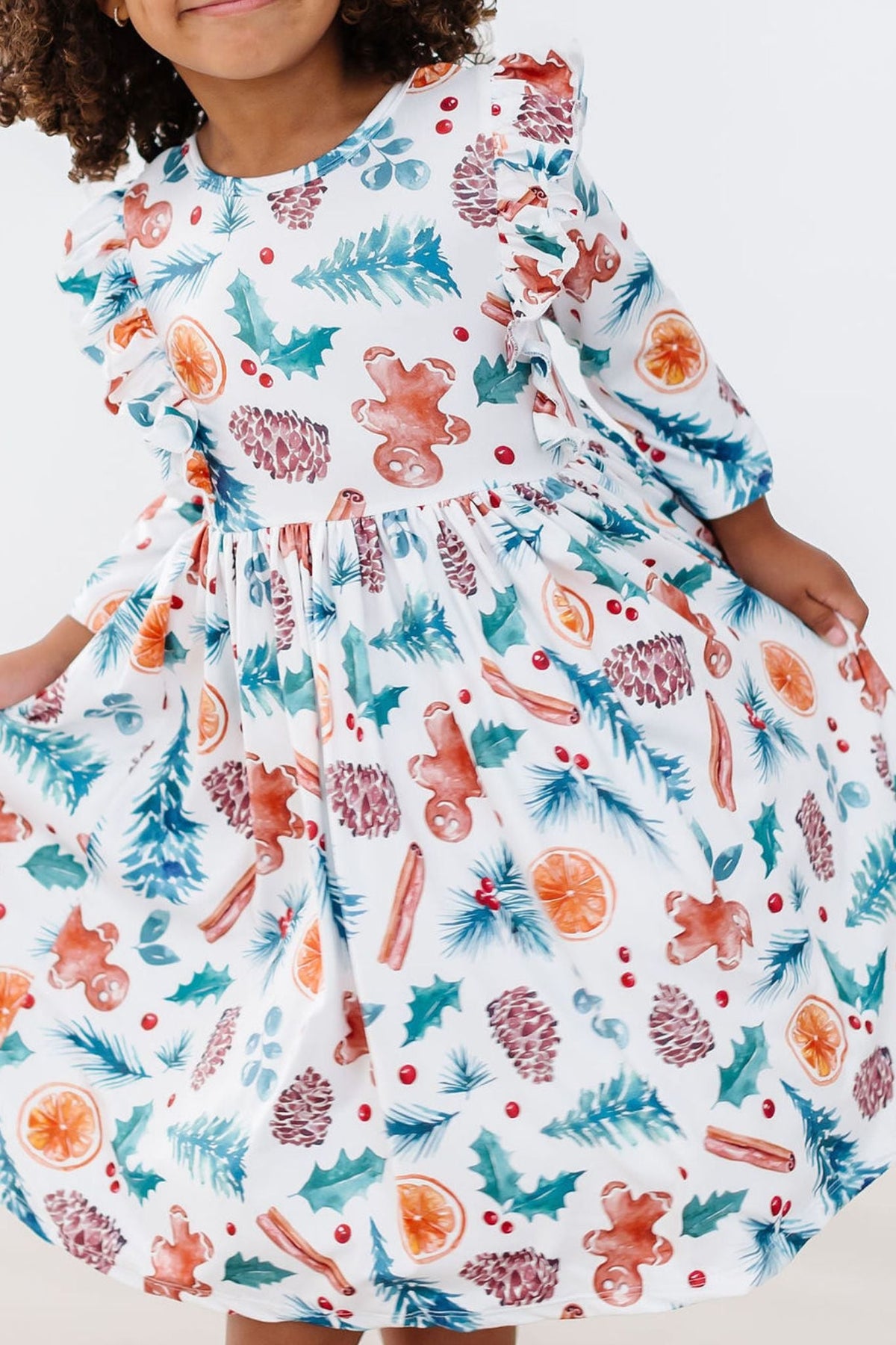 a girl wearing a dress with a pattern on it