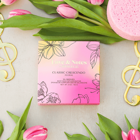 a pink box with flowers and a sponge