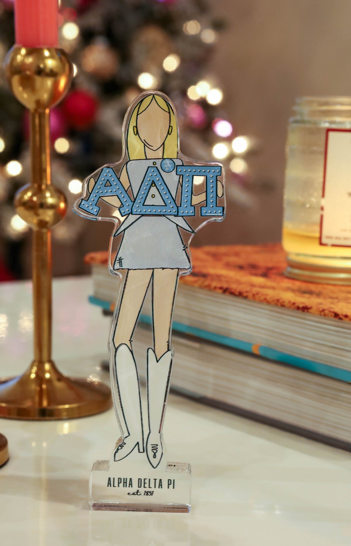 a paper cut out of a woman holding a sign