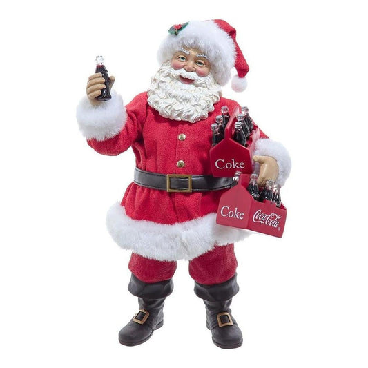 a santa claus holding a bag of soda