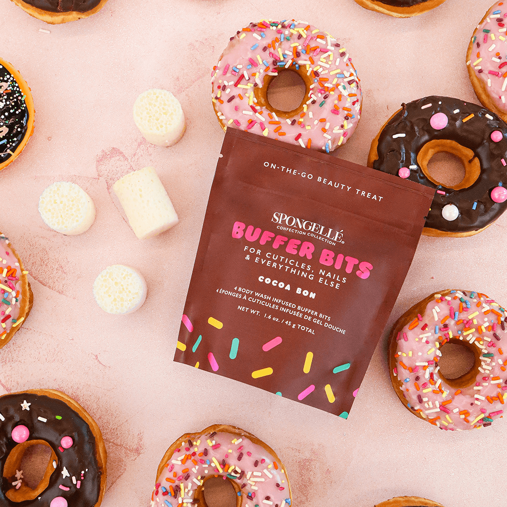 a group of donuts with a packet of sugar