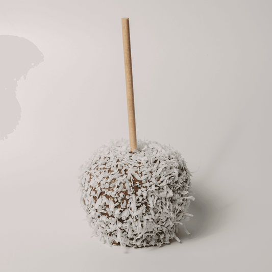 a candy apple covered in coconut