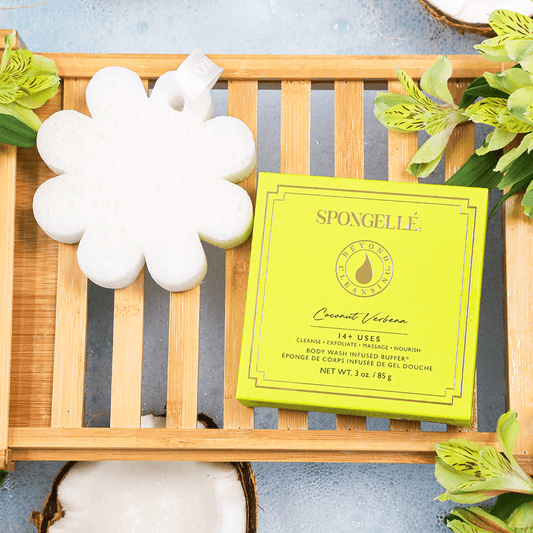 a sponge and a box on a wood tray