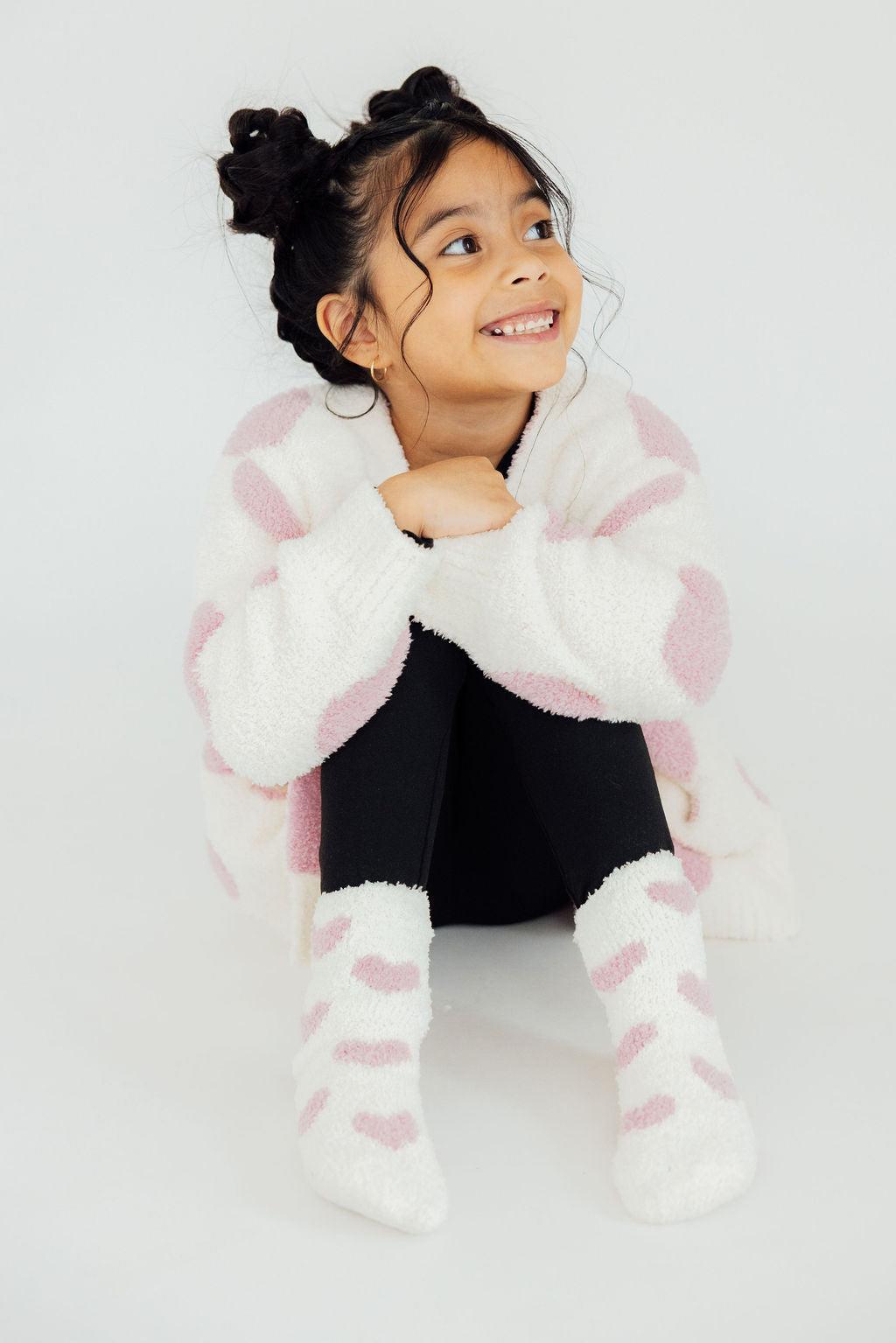 a girl sitting on the floor
