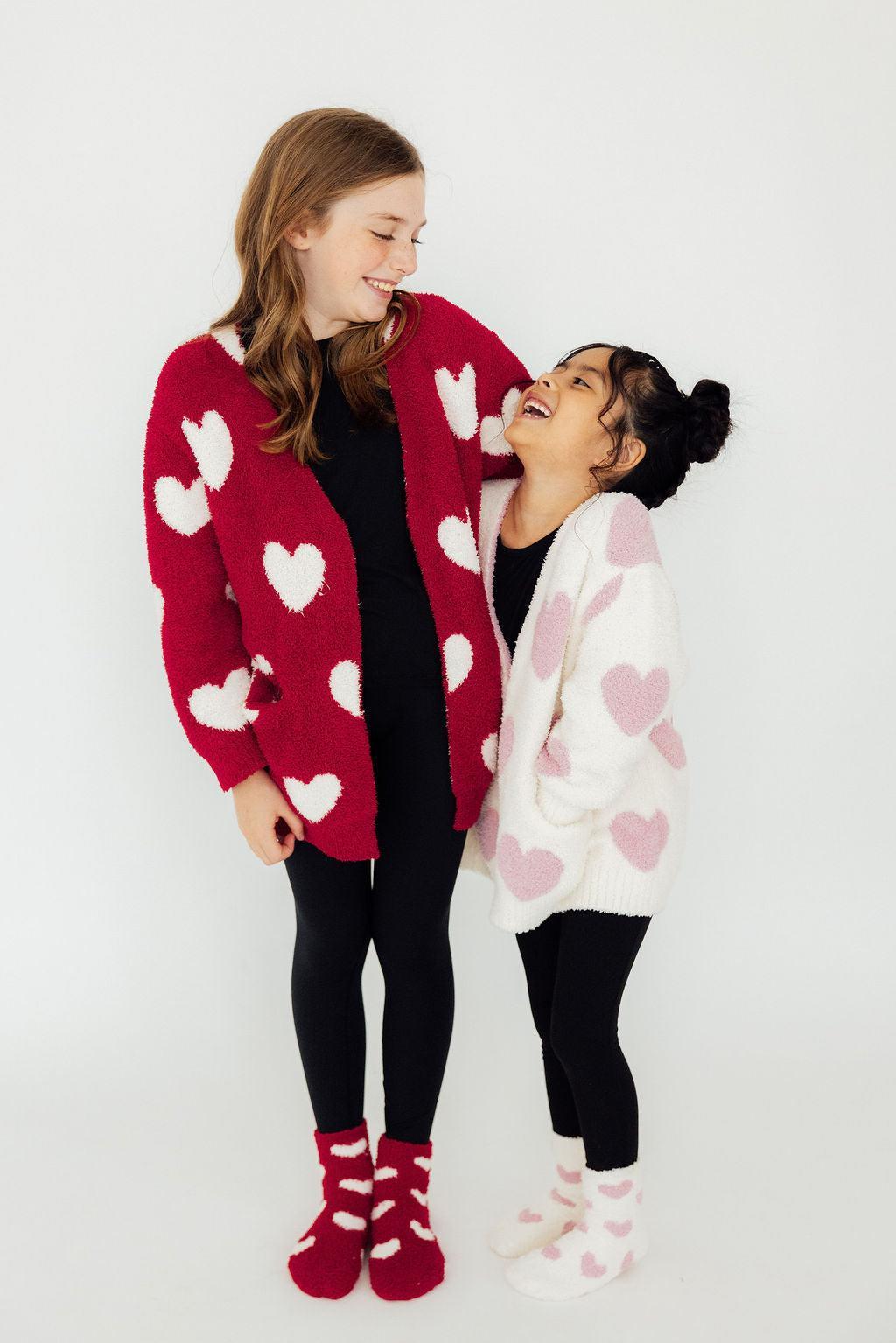 two girls standing together smiling