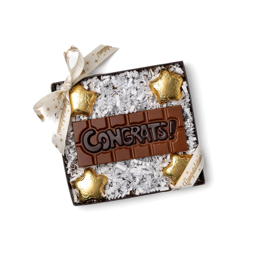 a chocolate bar with gold stars and white sprinkles