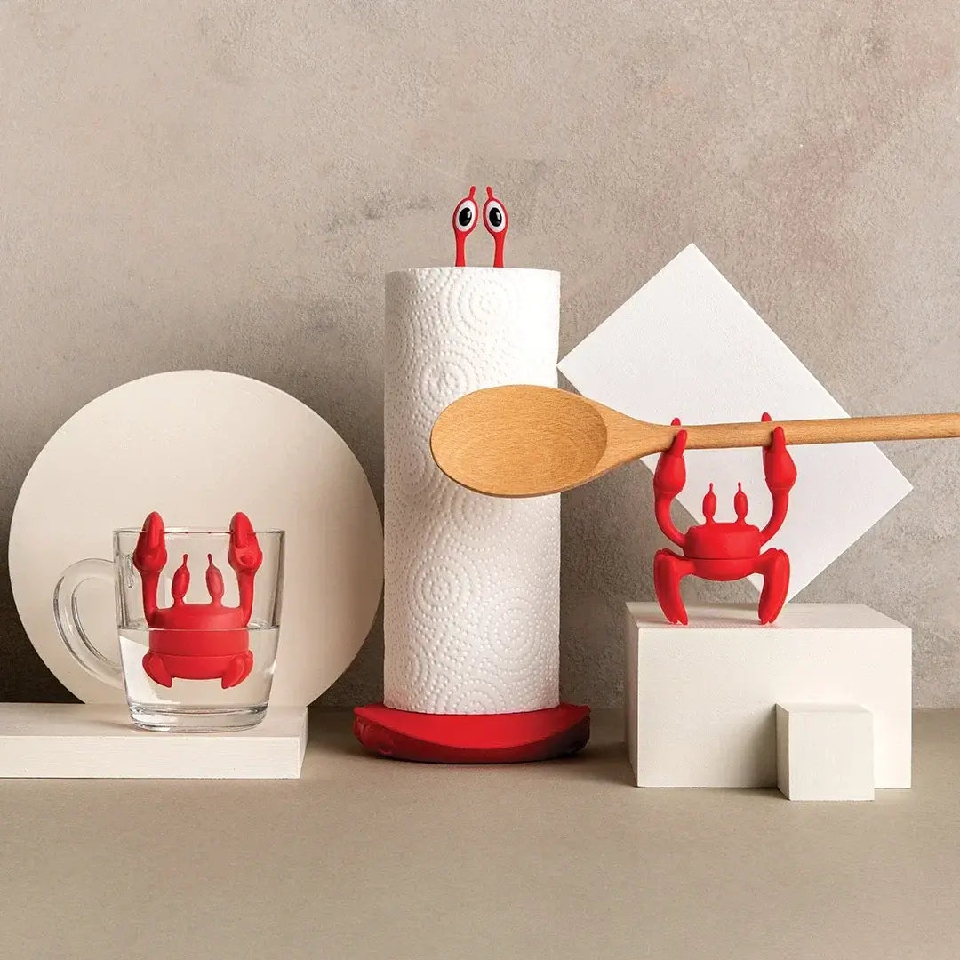 a red crab shaped objects with a wooden spoon