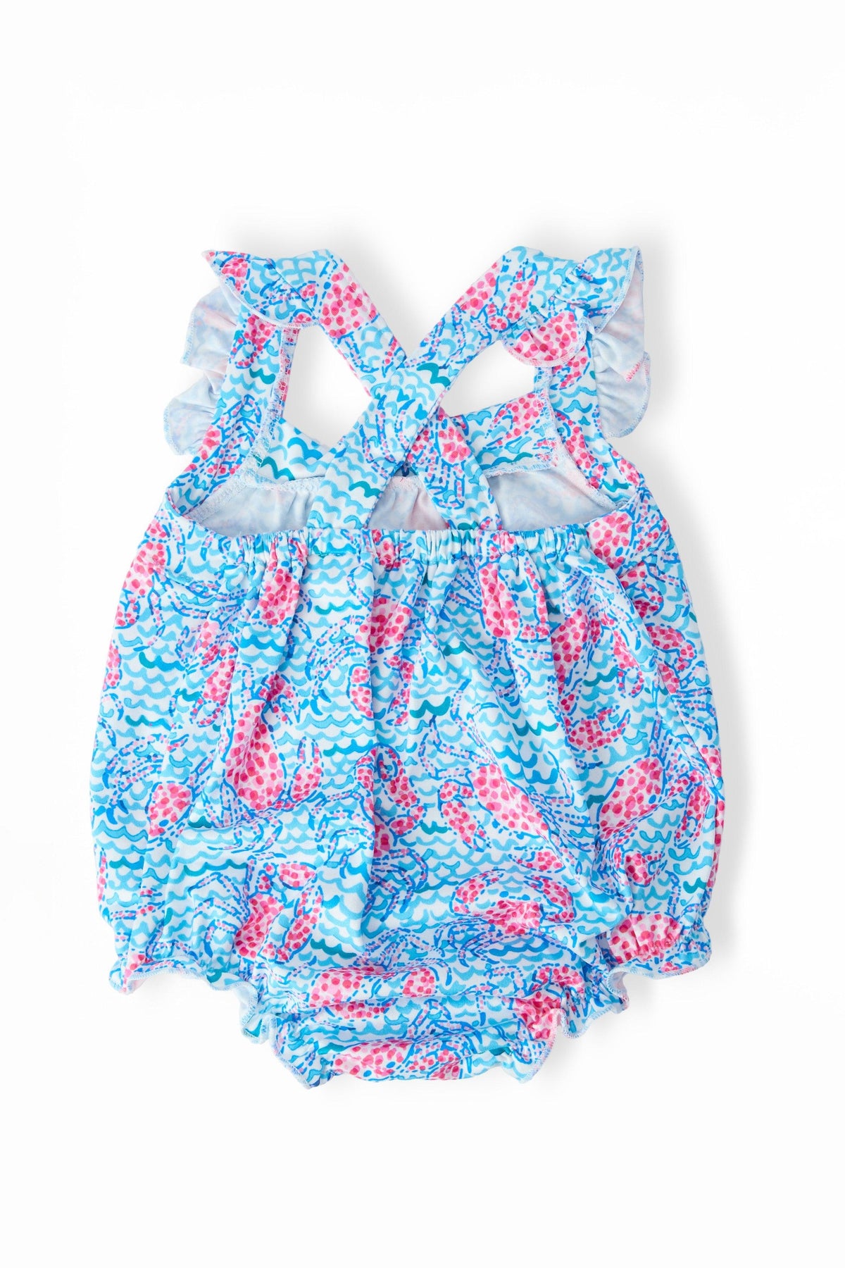 a blue and pink romper with pink and white fish print