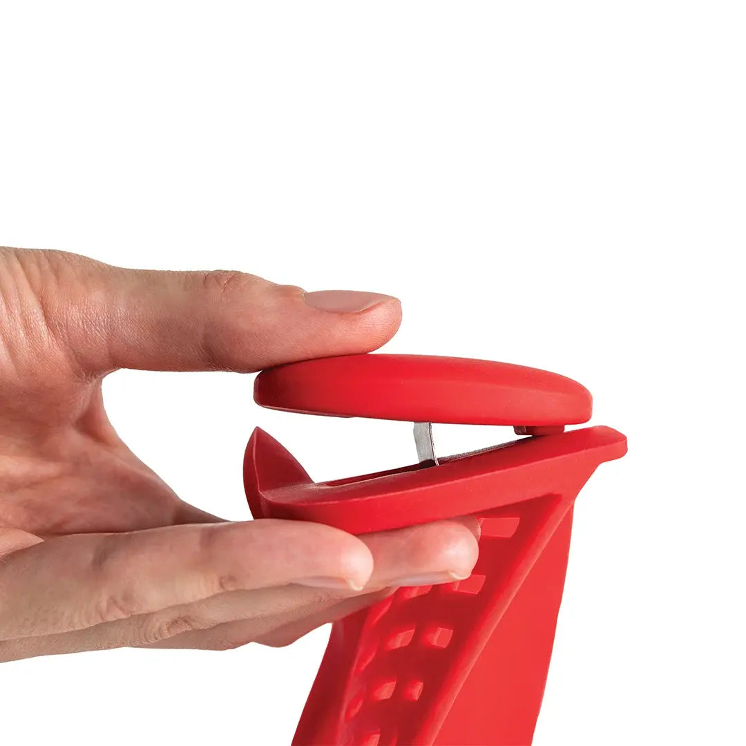 a hand holding a red object