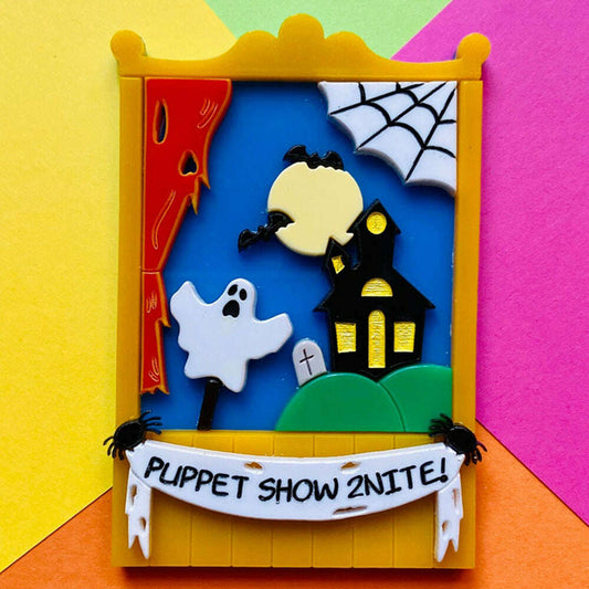 a toy frame with a ghost and spider webs