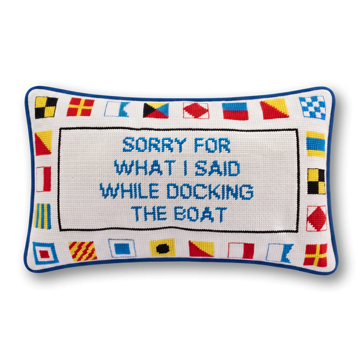 a white rectangular pillow with blue and red text