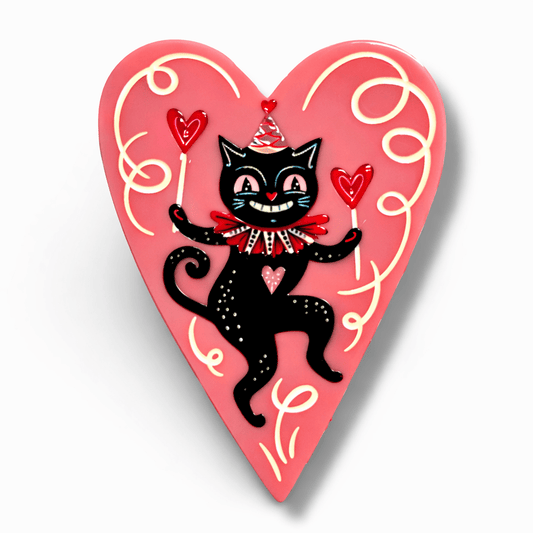 a heart shaped object with a cat on it