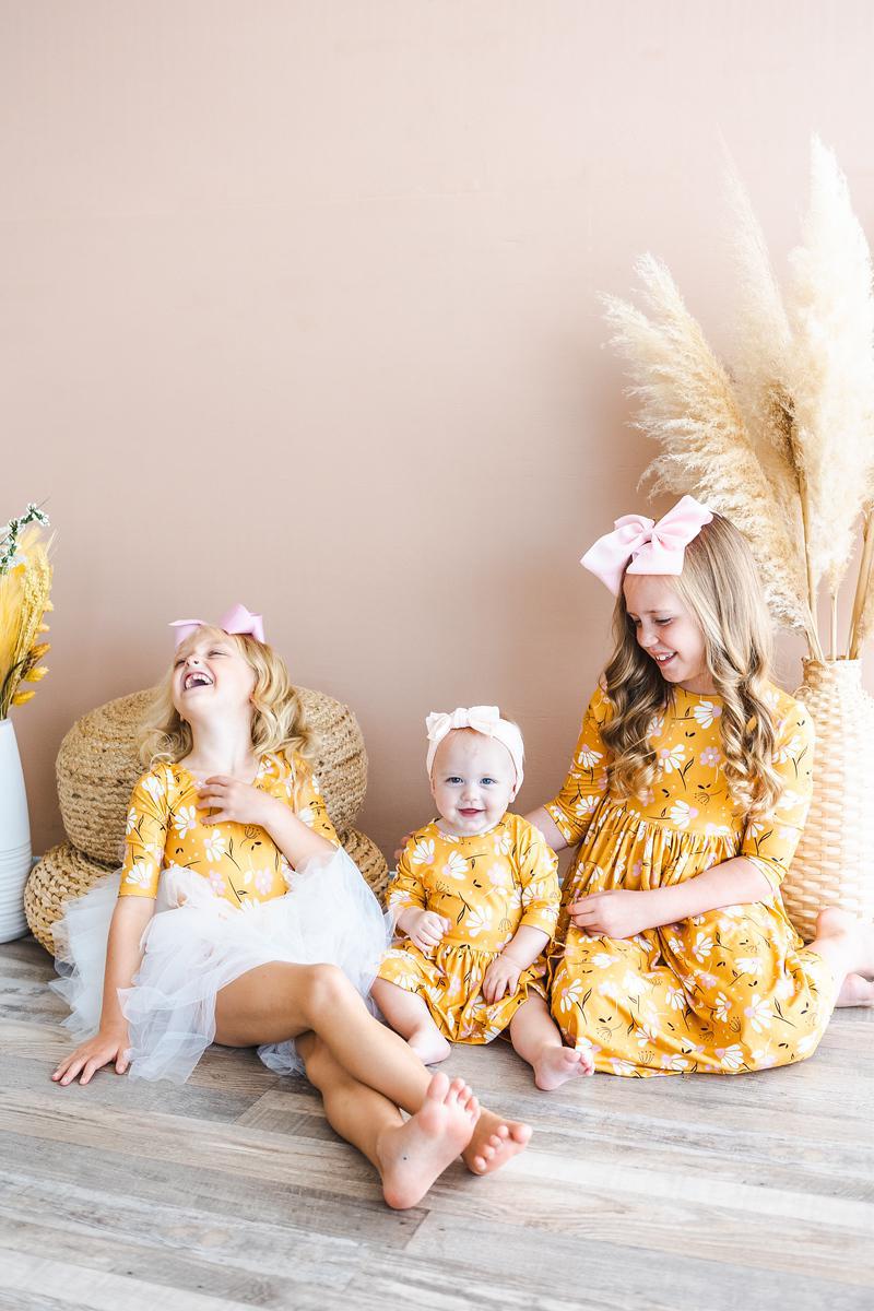 a group of girls sitting on the floor