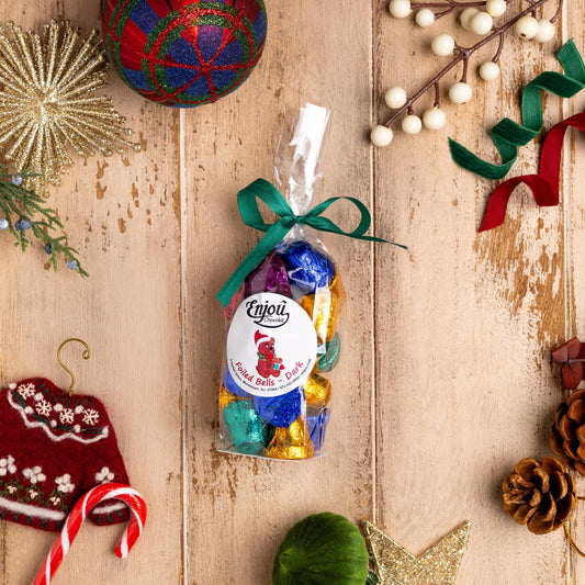 a bag of candy next to ornaments