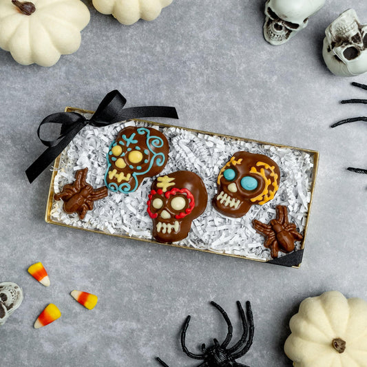 a box of chocolate skulls and spiders