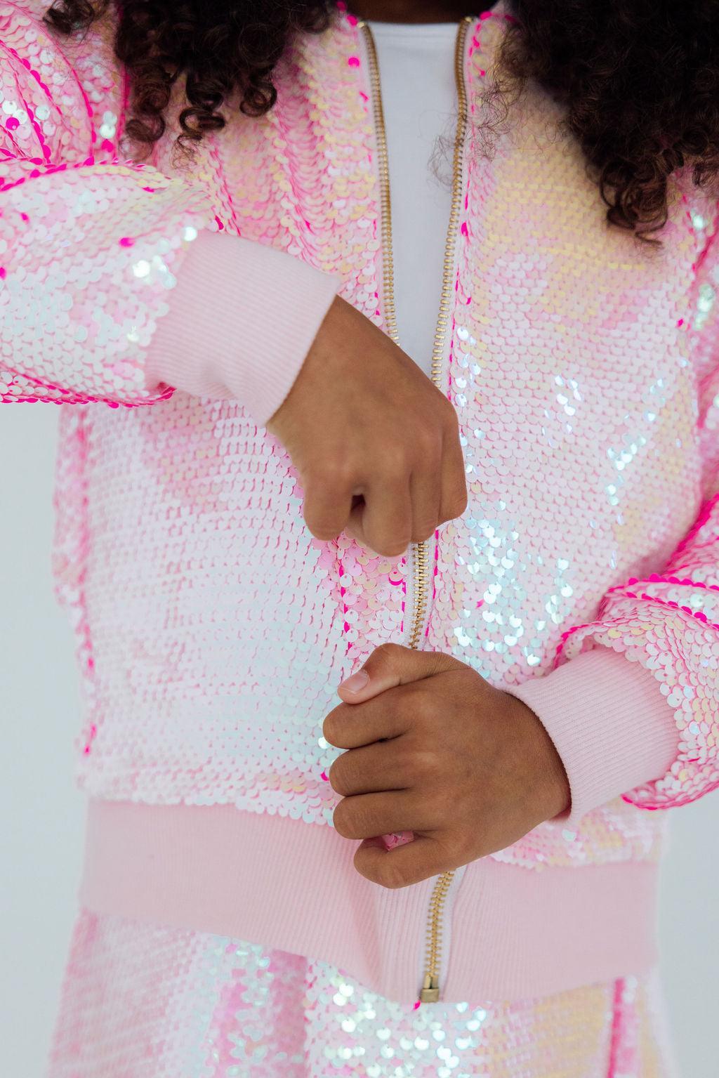 a person wearing a pink jacket