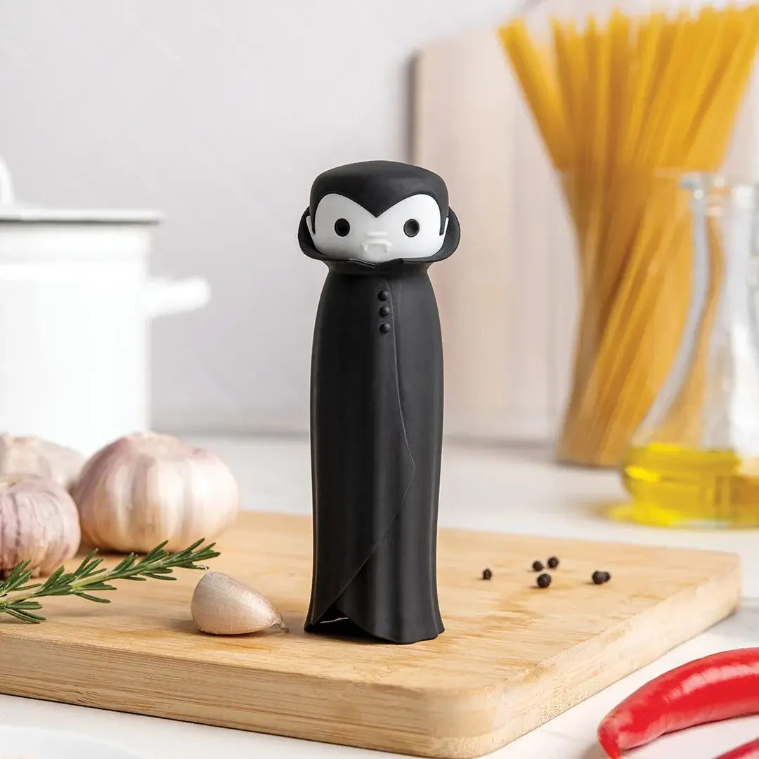 a black toy on a cutting board