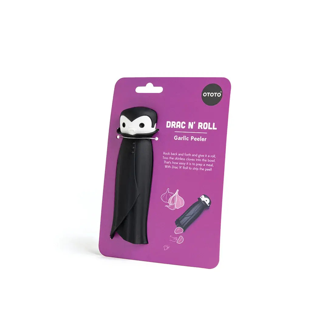 a black penguin toy in a purple package