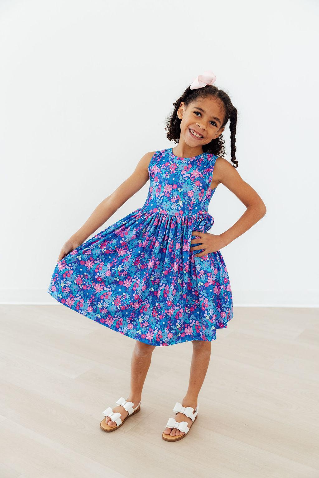 a girl in a blue dress