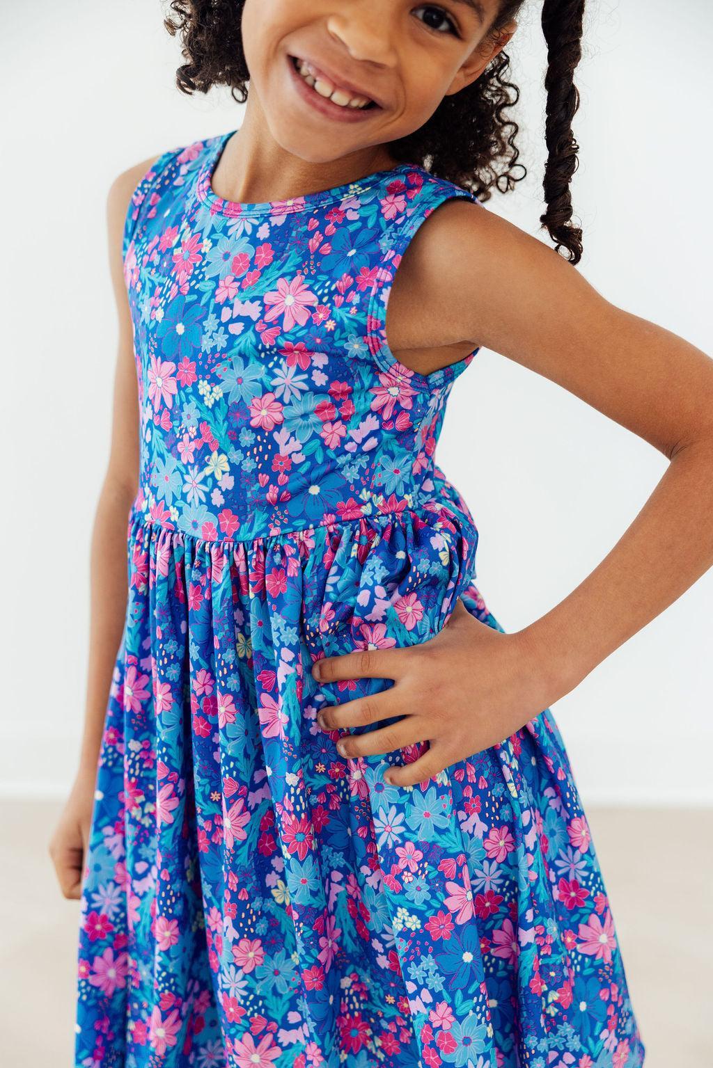 a girl wearing a blue dress