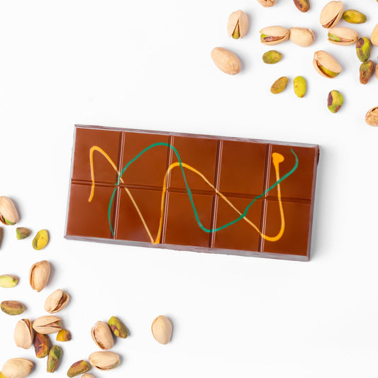 a chocolate bar with pistachios on it