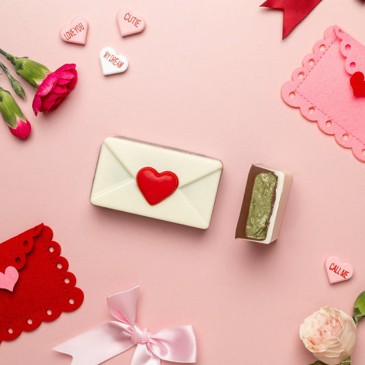 a pink background with flowers and envelopes