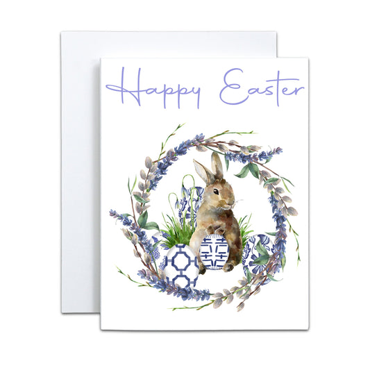 a card with a bunny and flowers