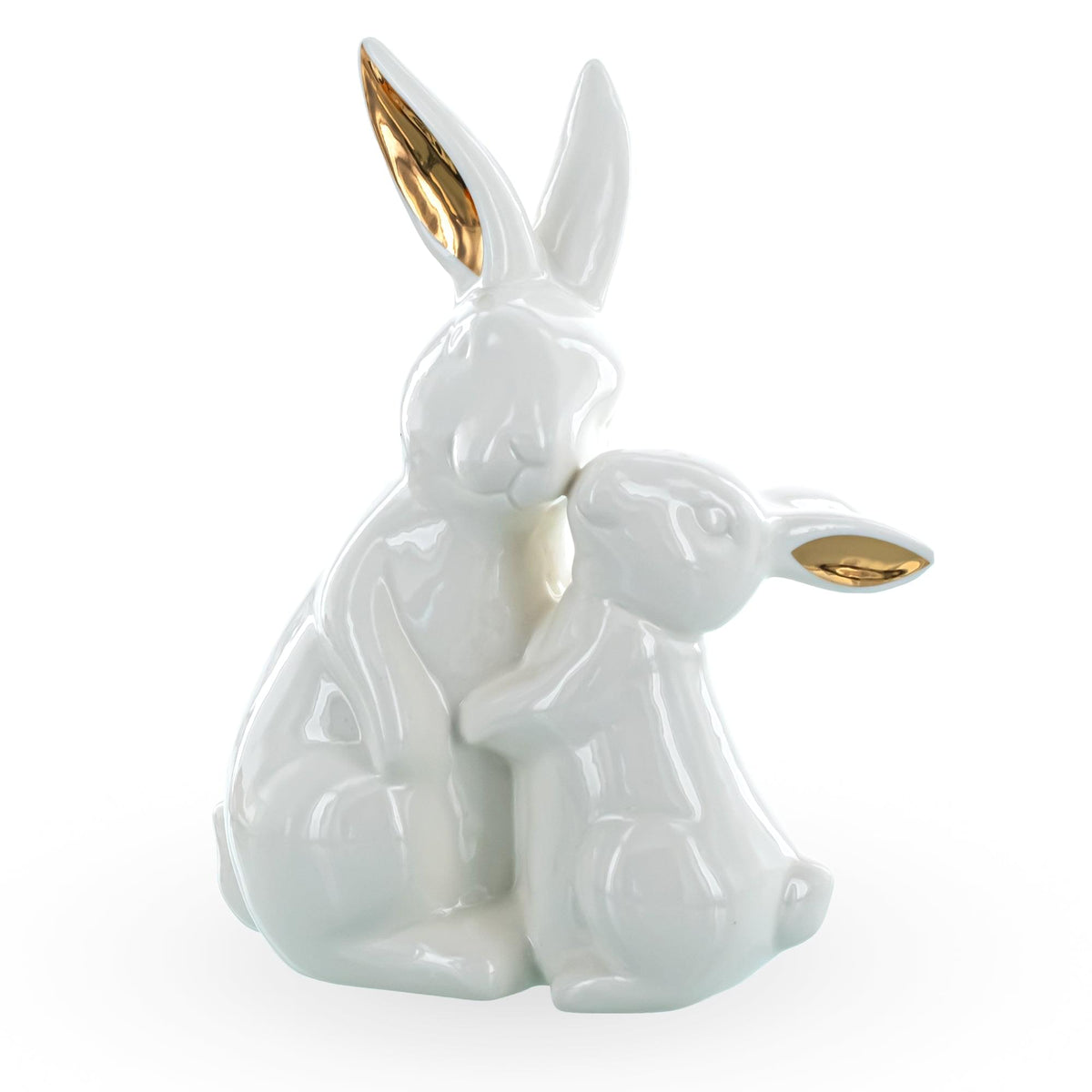 a white rabbit figurine with gold ears